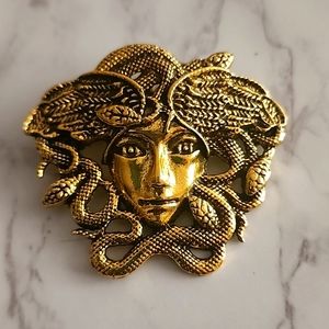 Medusa brooch gold and black fashion jewelry..new
